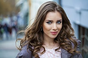 a woman in the city using luxurious human Russian hair extensions